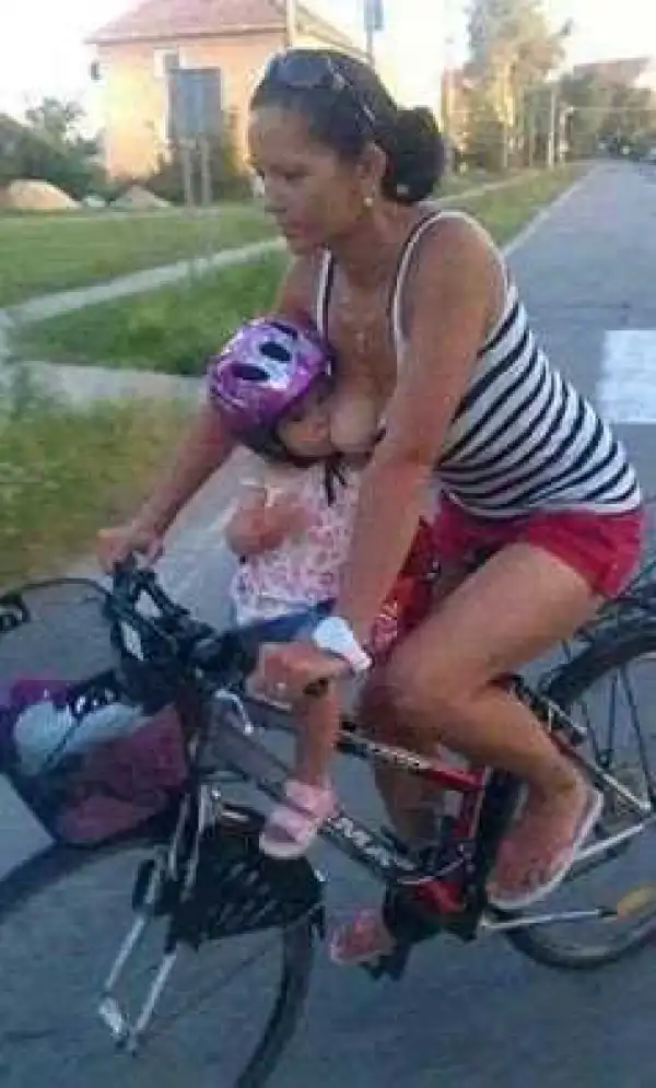 Woman spotted breastfeeding her child while cycling